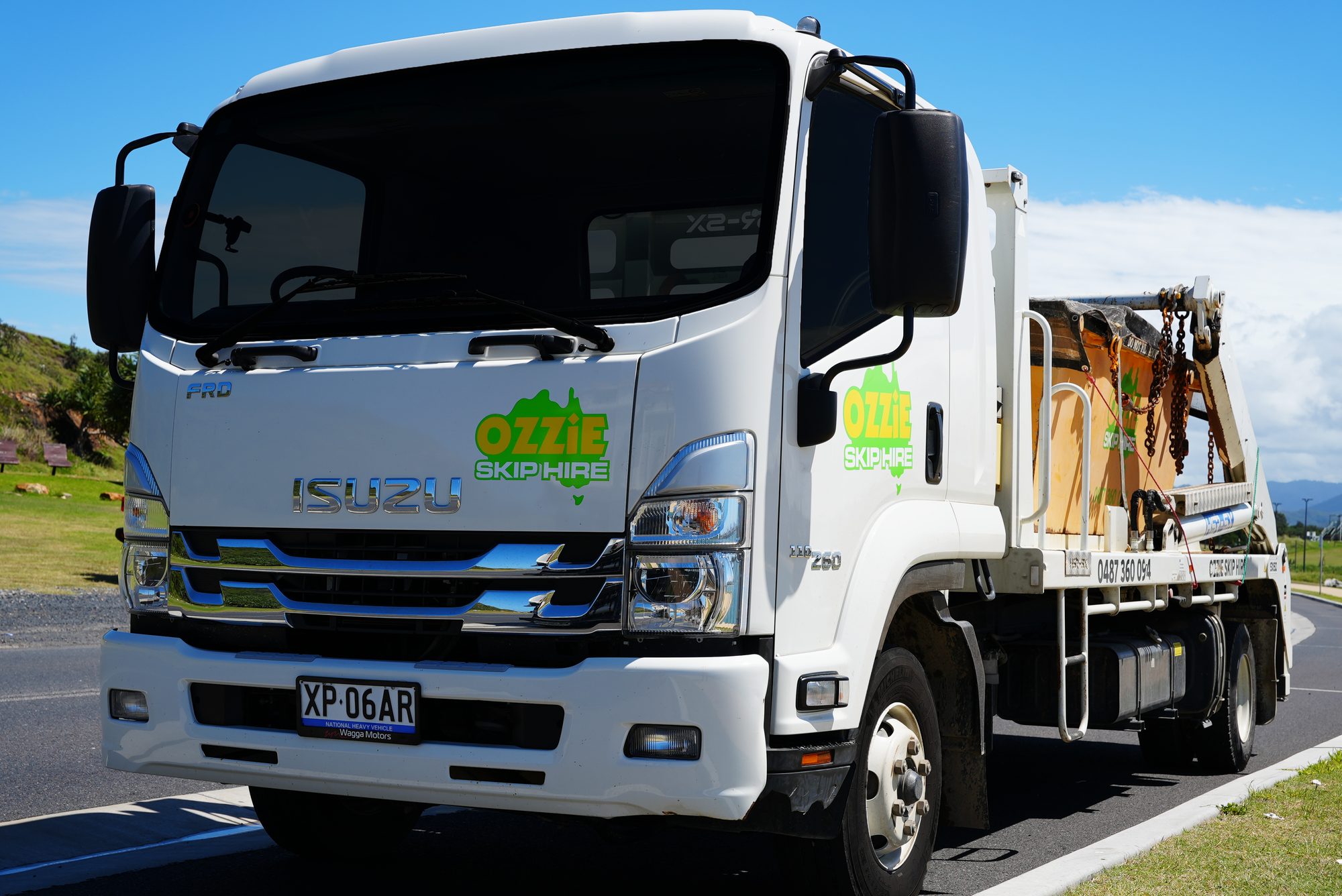 Branded Ozzie Skip Hire skip truck parked on a Coffs Harbour street